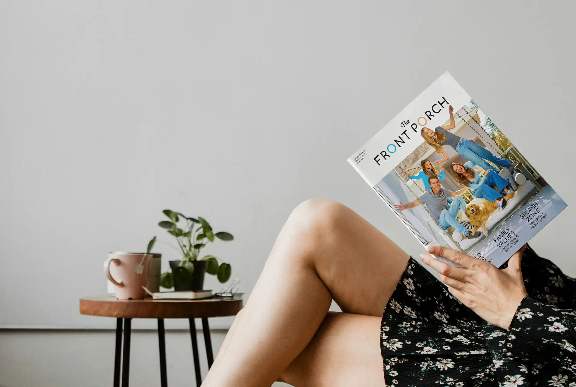 Woman reading The Front Porch magazine at home